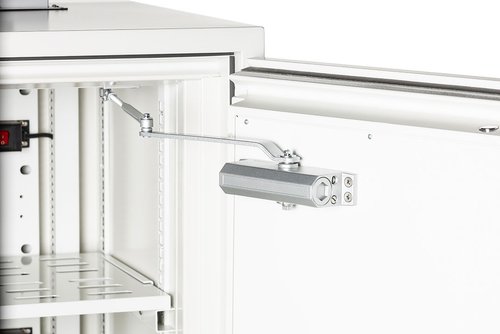 Close-up of a hinge on a white cabinet