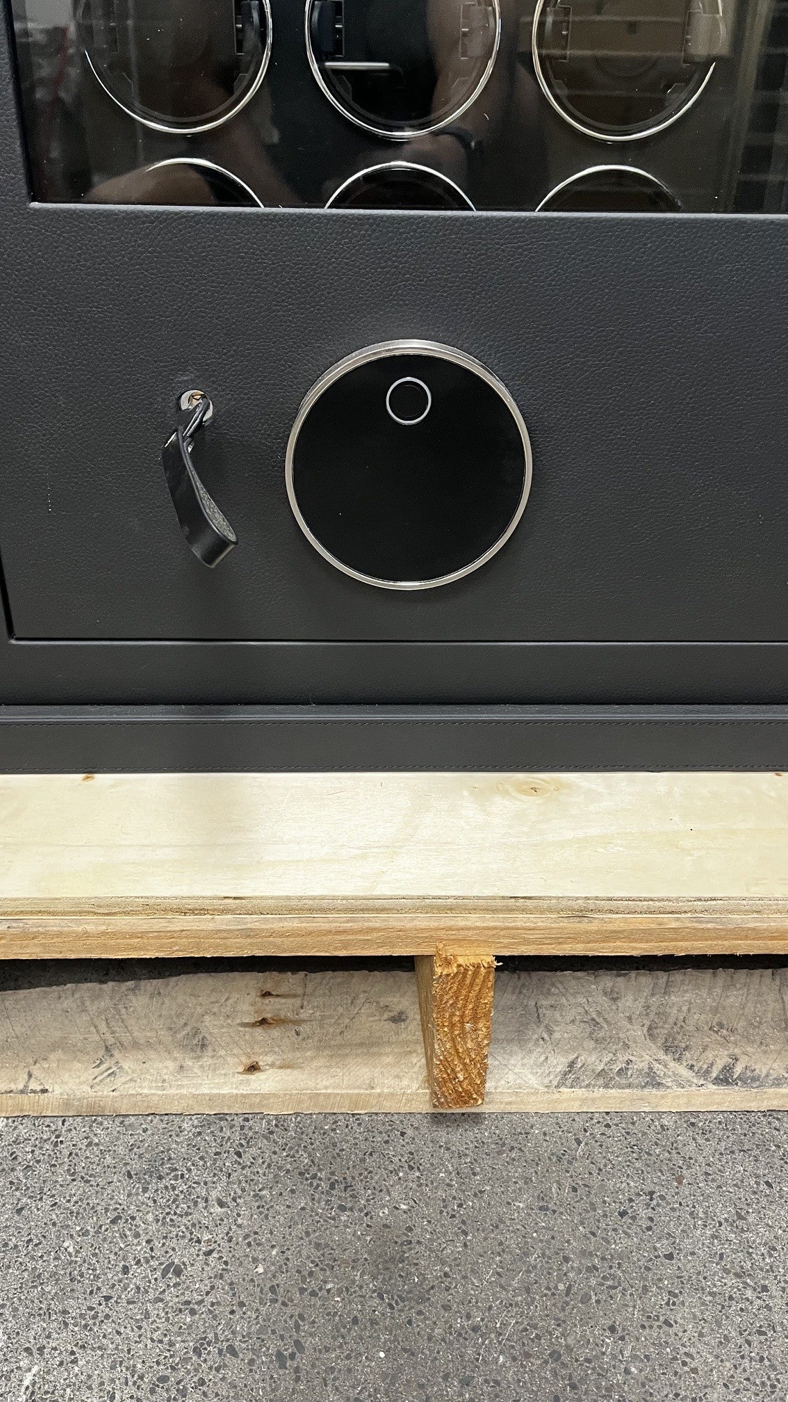 View of the front safe. It has a fingerprint scanner lock with a keypad.  