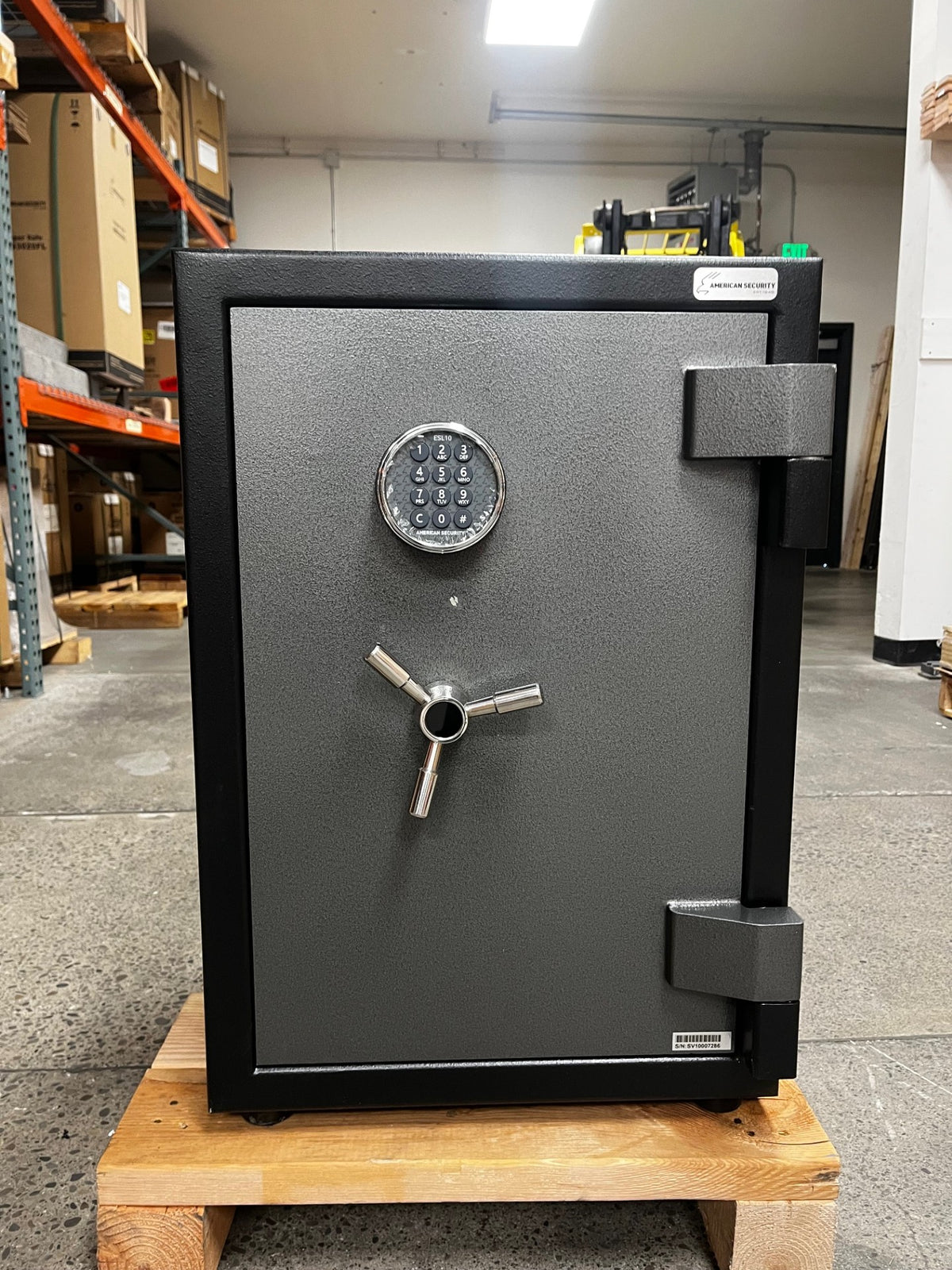 Front view of the safe, the door has a small scratch underneath the lock.  