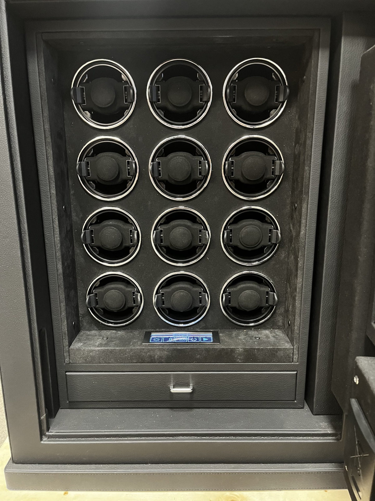 View of the 12 watch winders. They all work and can function individually if needed.  The safe does not come with lights. 