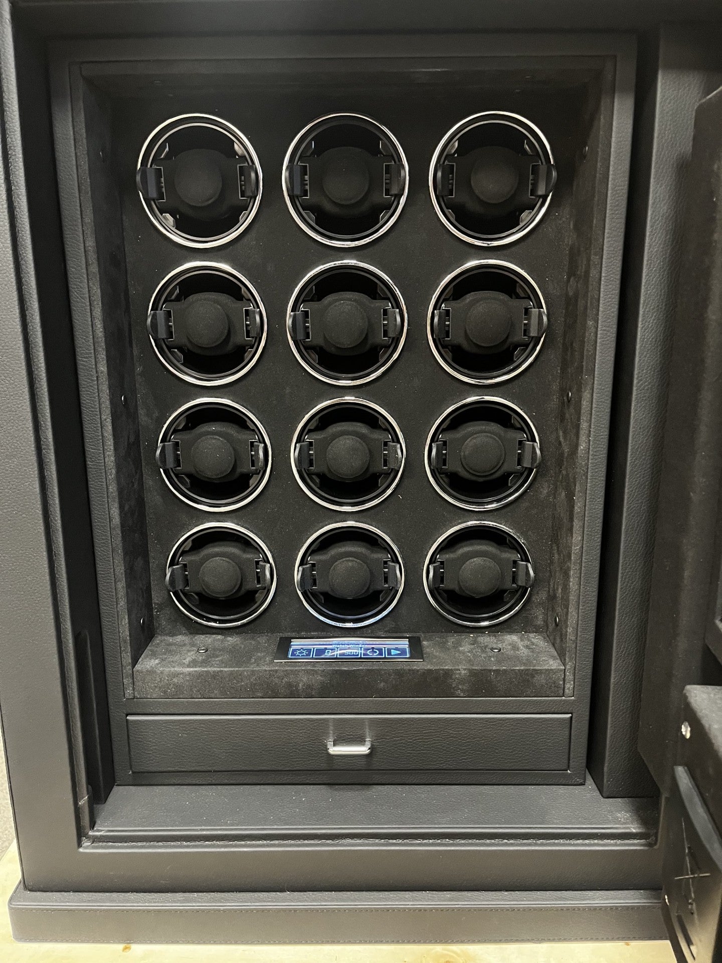 View of the front safe. It has a fingerprint scanner lock with a keypad.  