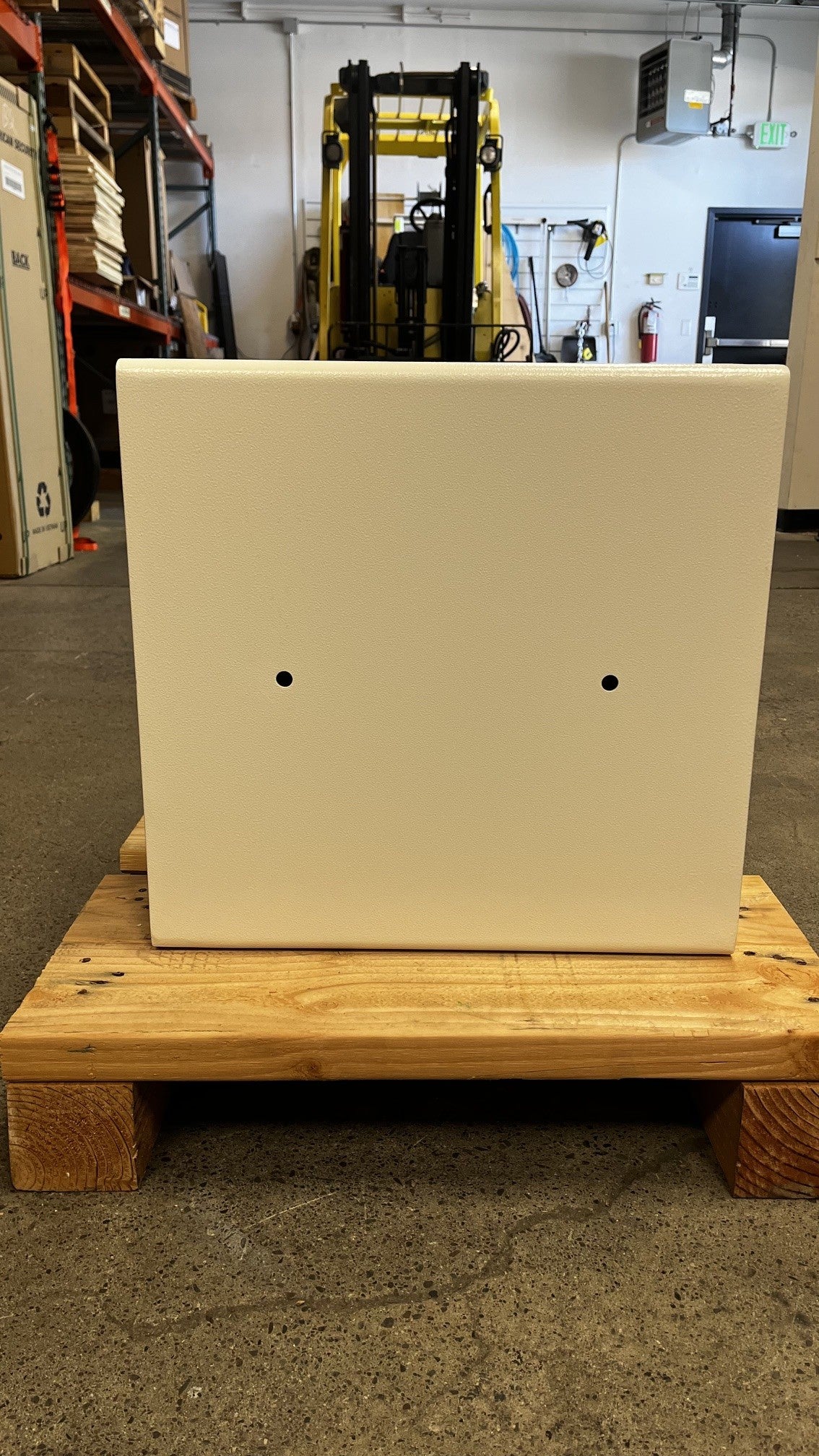 View of the back side of the safe. The safe has a total of 4 predrilled holes to mount it. It has 2 on the back and 2 in the inside of the safe. 