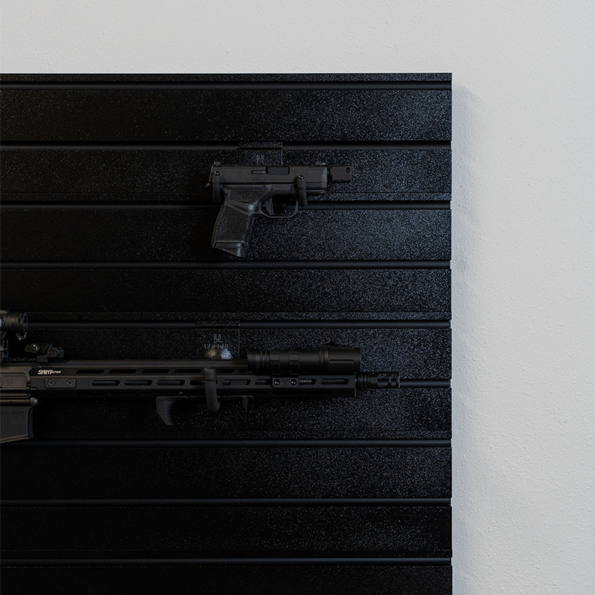 Black gun storage cabinet with multiple compartments on a white background