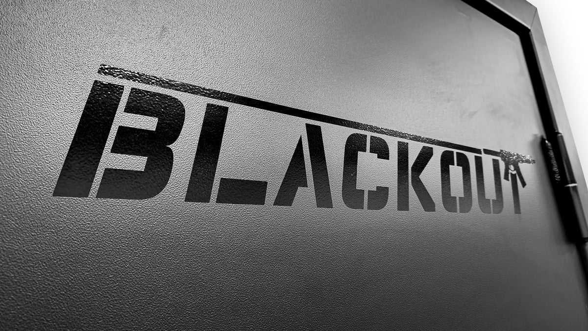 Black 'BLACKOUT' logo on a Vulcan Vault Door