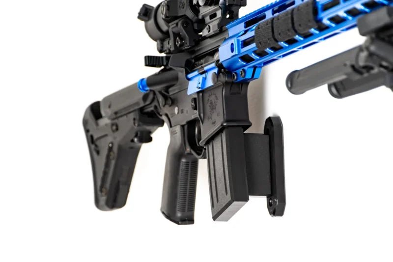 Close-up of a black and blue rifle on a white background