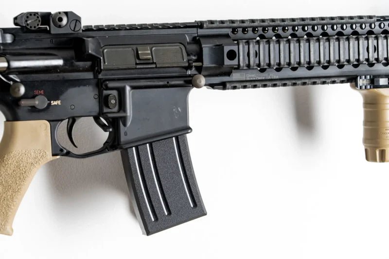 Close-up of a rifle with a white background