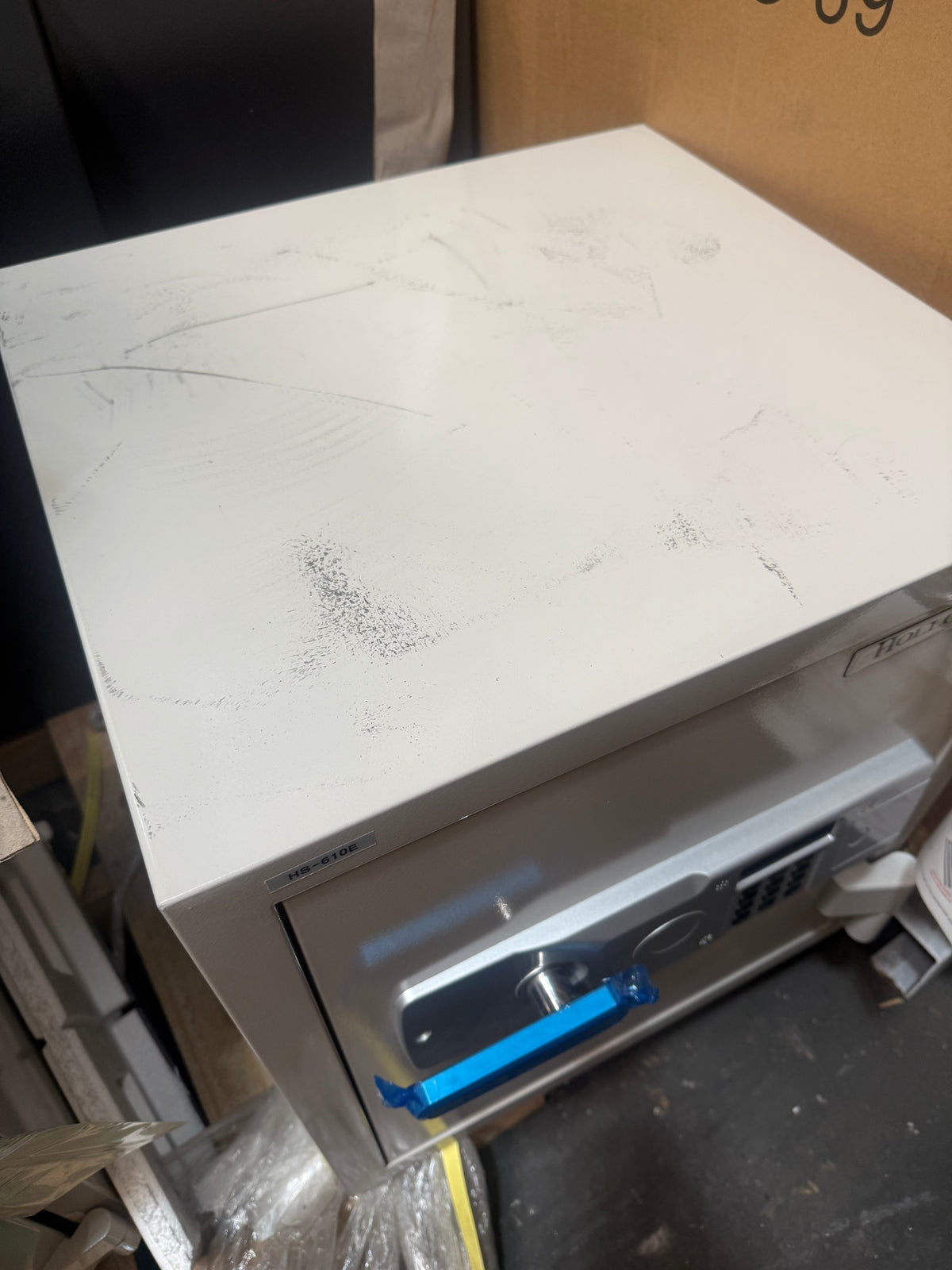 Blemished Hollon HS-610E top of safe with scuffs and scrapes visible. 