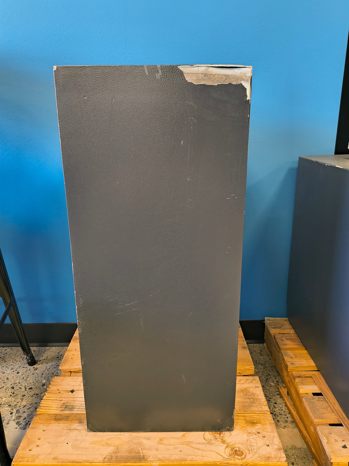 Blemished Protex FDD-3214 II back of safe displaying damage in top right corner. 