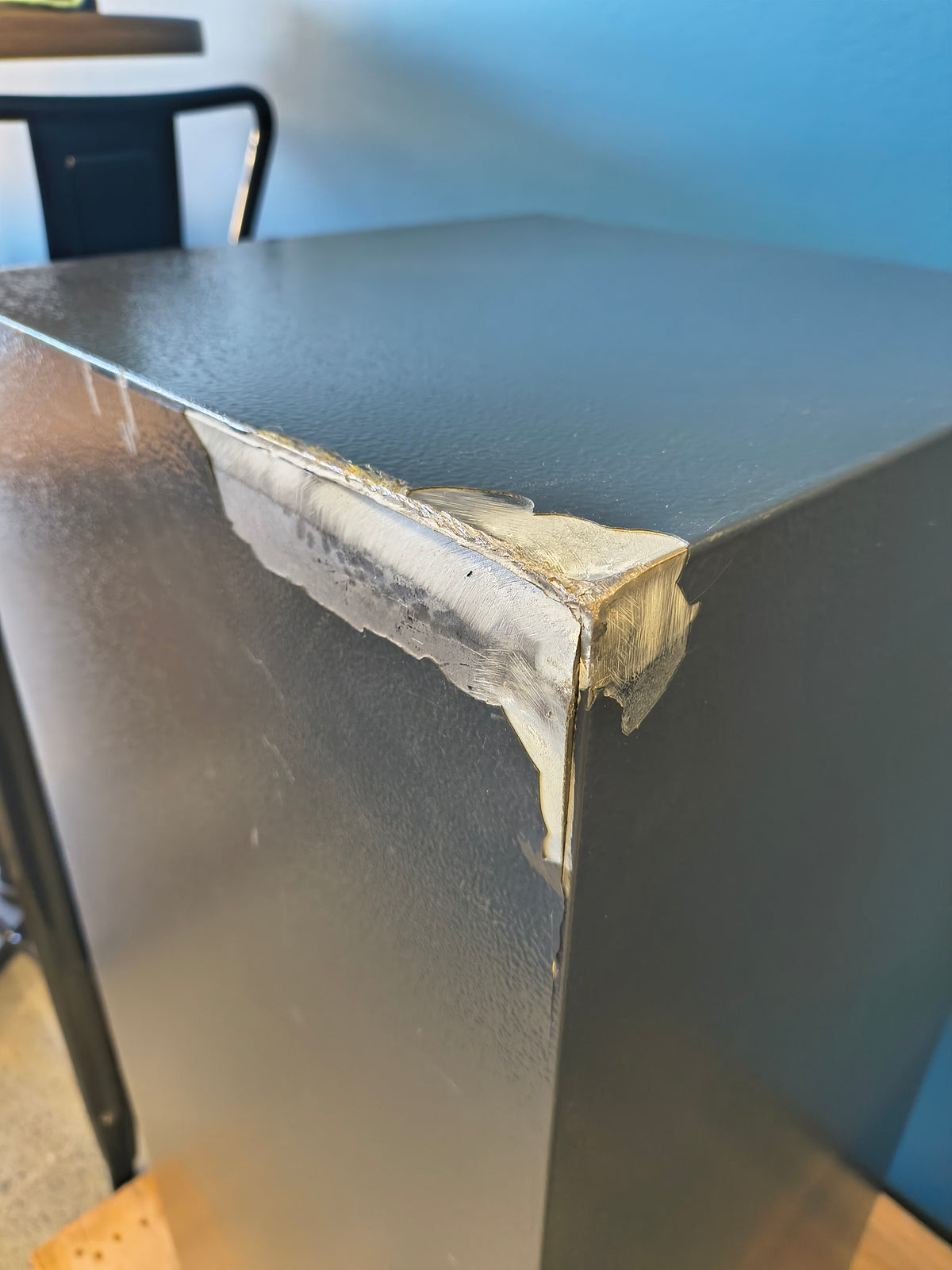 Blemished Protex FDD-3214 II damage to back top right corner of safe where the steel has split causing a potential security vulnerability. 