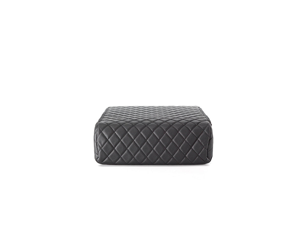 Black quilted rectangular safe on a white background