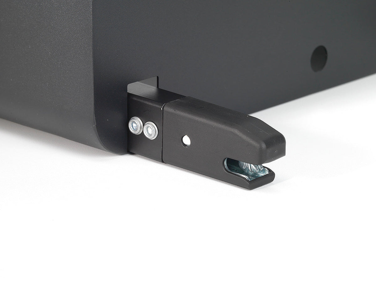 Close-up of a black metal bracket on a white background