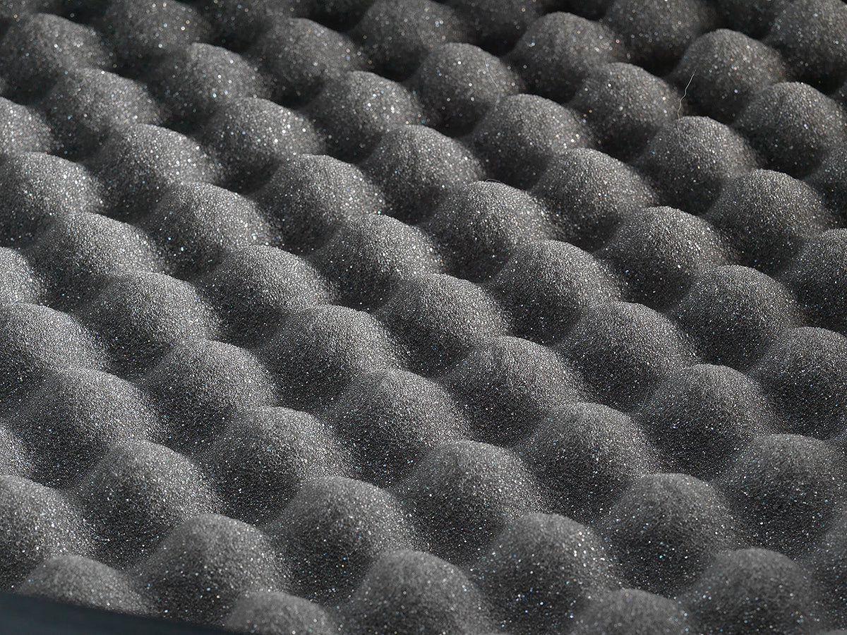 Close-up of black acoustic foam panels arranged in a grid pattern