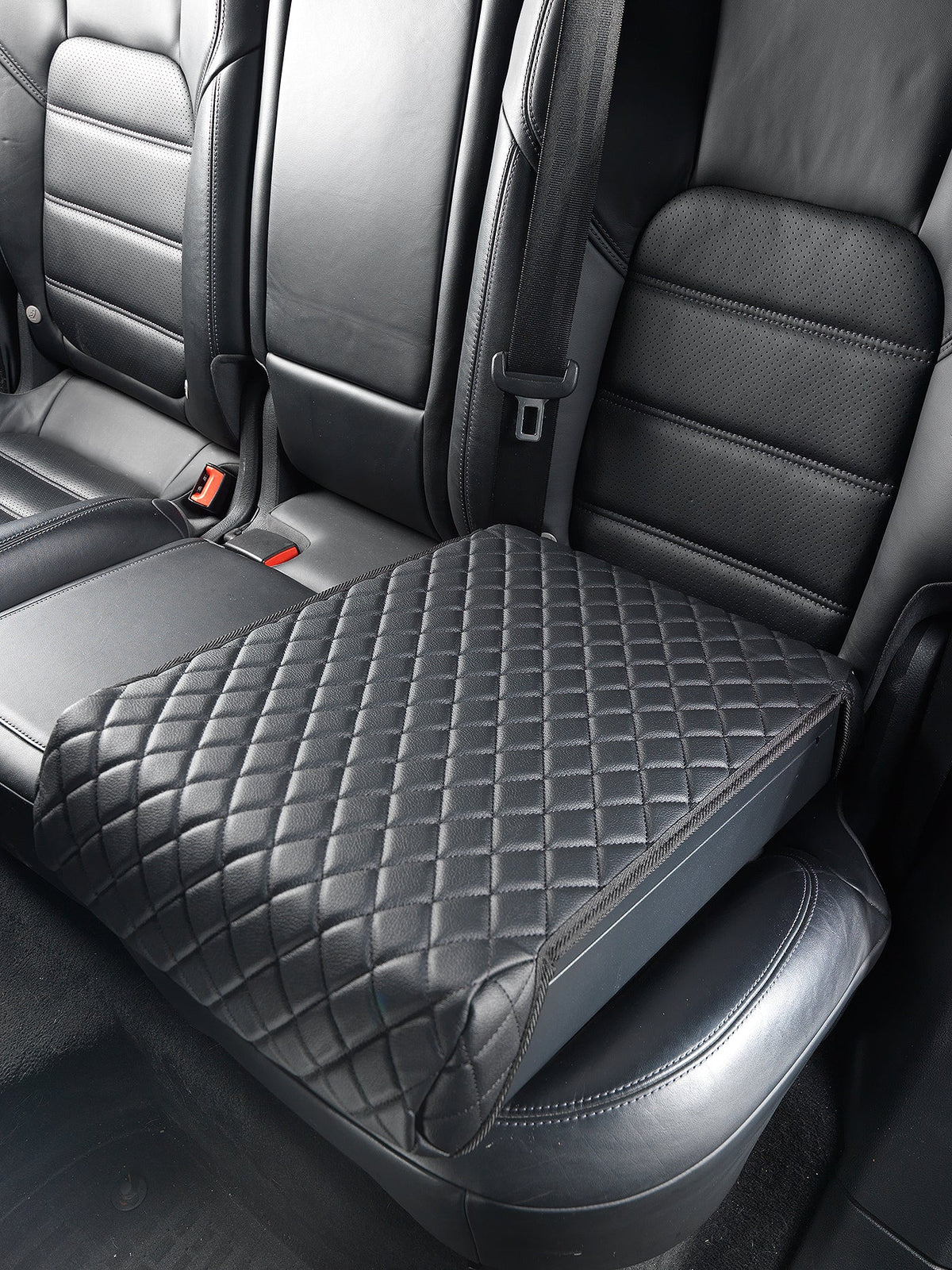 Car seat cover with diamond pattern on a car seat