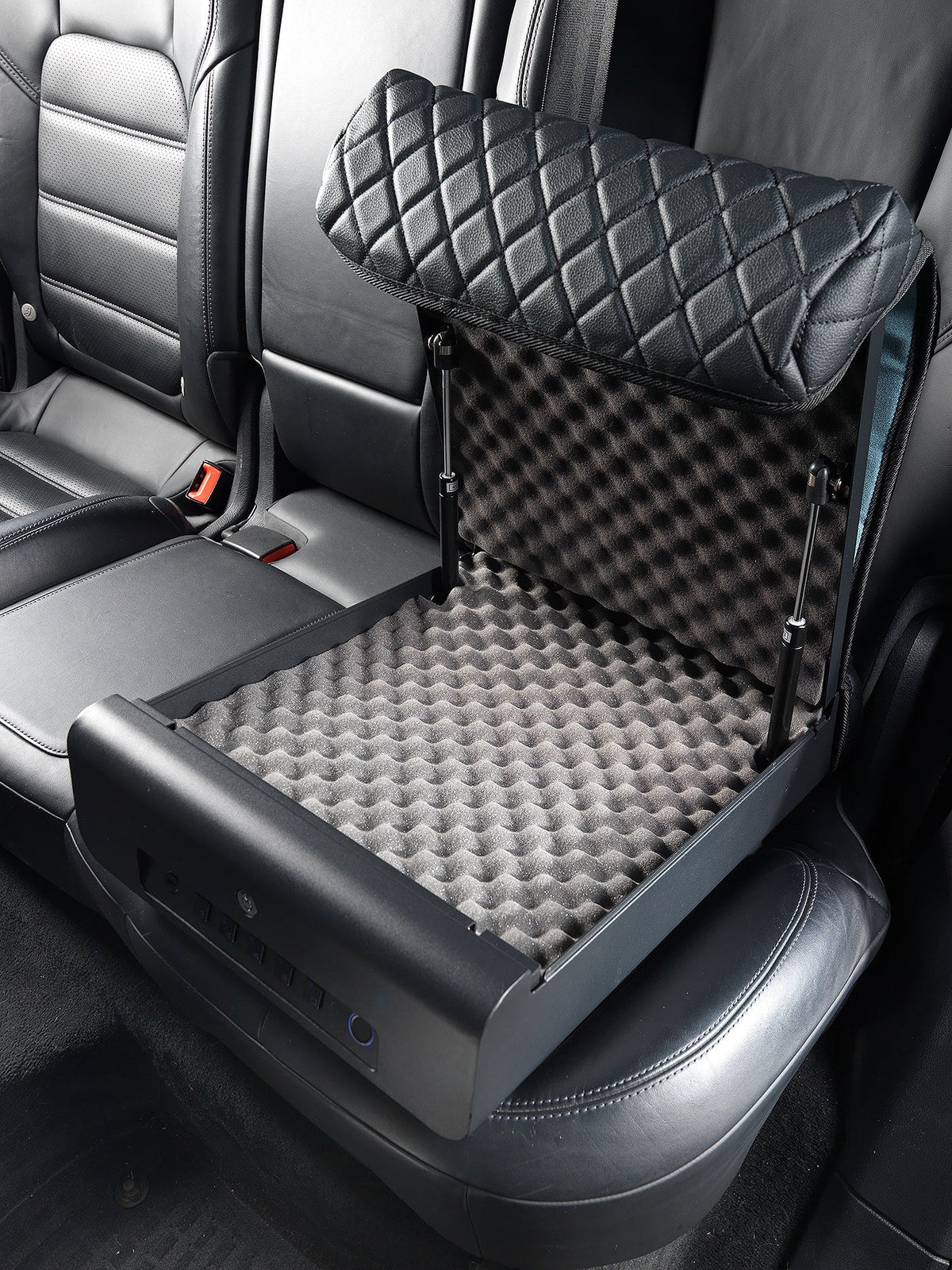 Car seat cover with quilted backrest and textured seat pad in a vehicle.