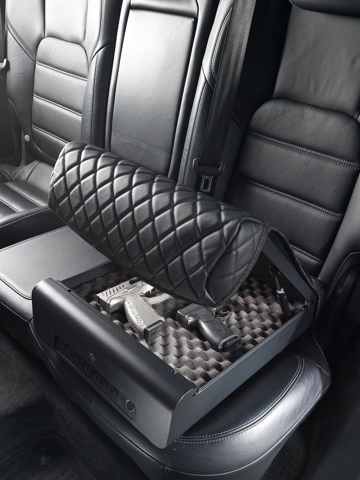 Car seat cover with quilted design and storage compartment on a car seat