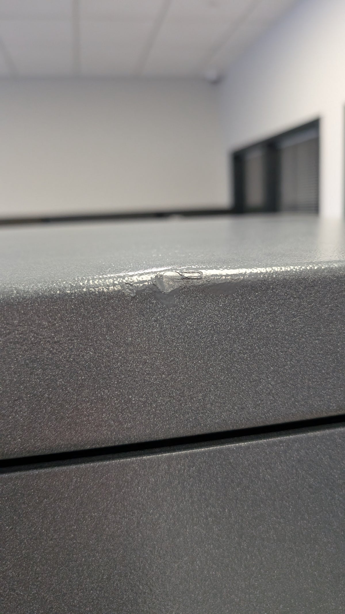 Blemished AMSEC NF6030E5 blemish on front of safe on top edge. 