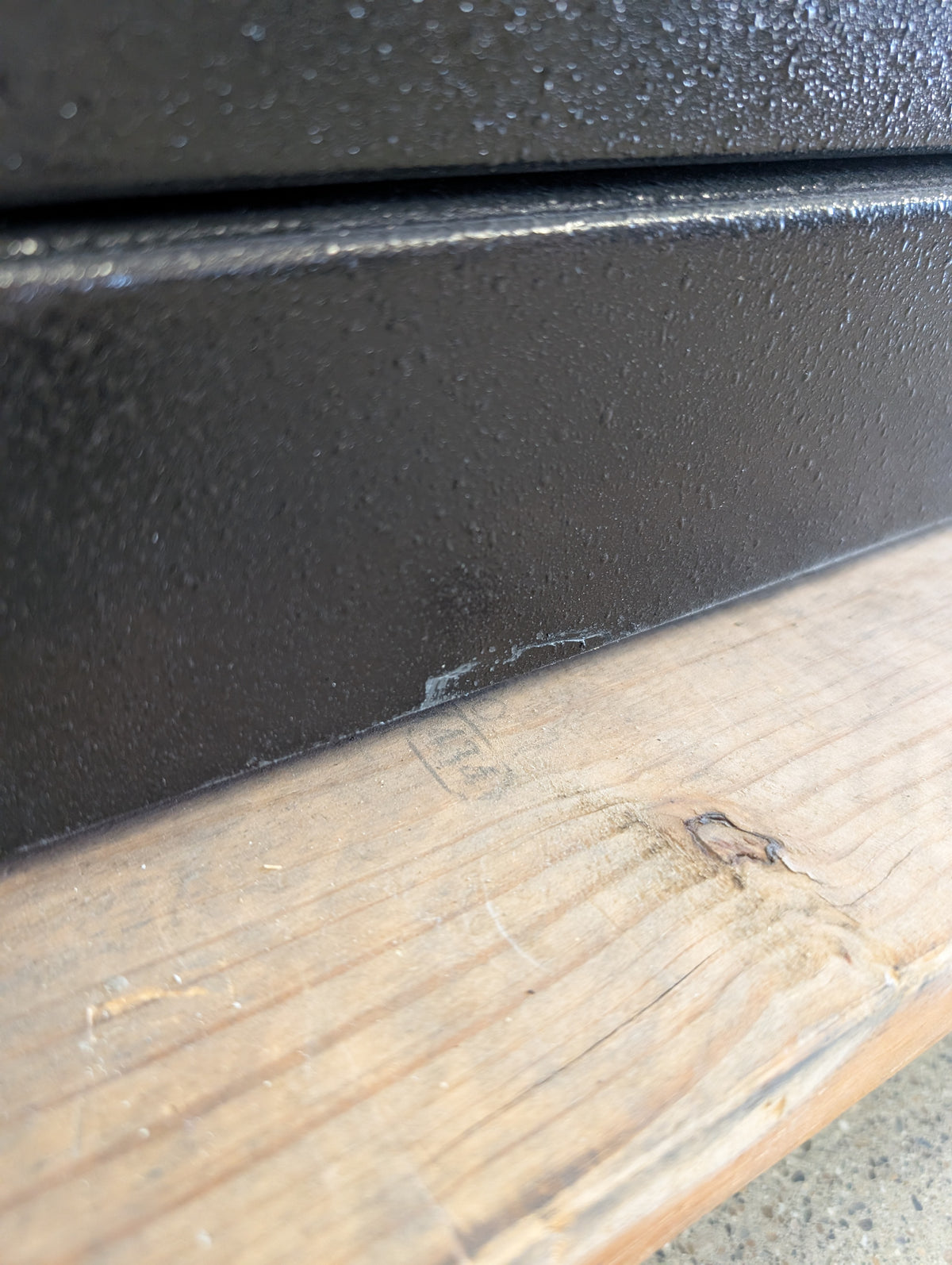 Scratch on the front lower area of the safe. 