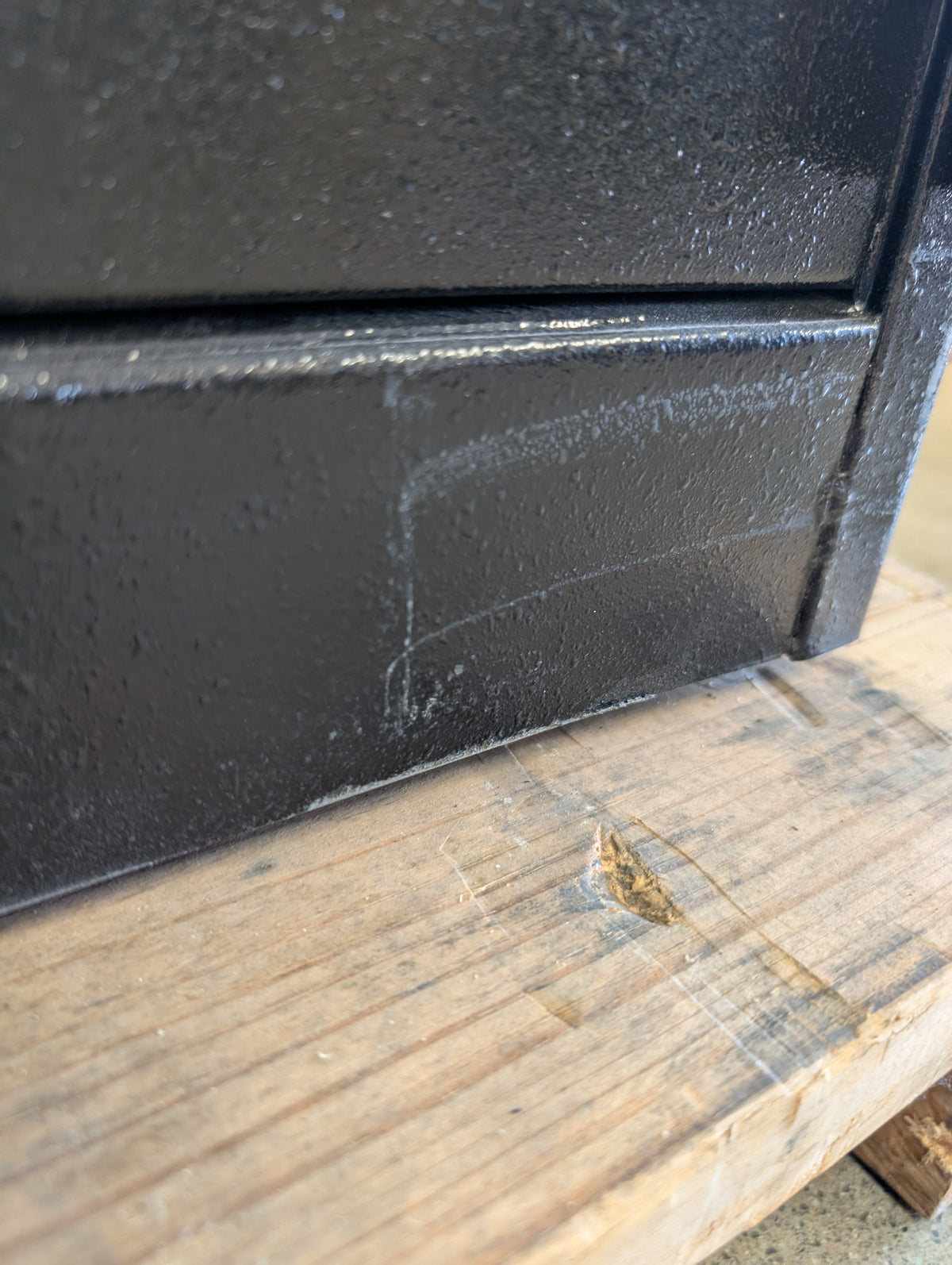 scratches on the lower front area of the safe. 