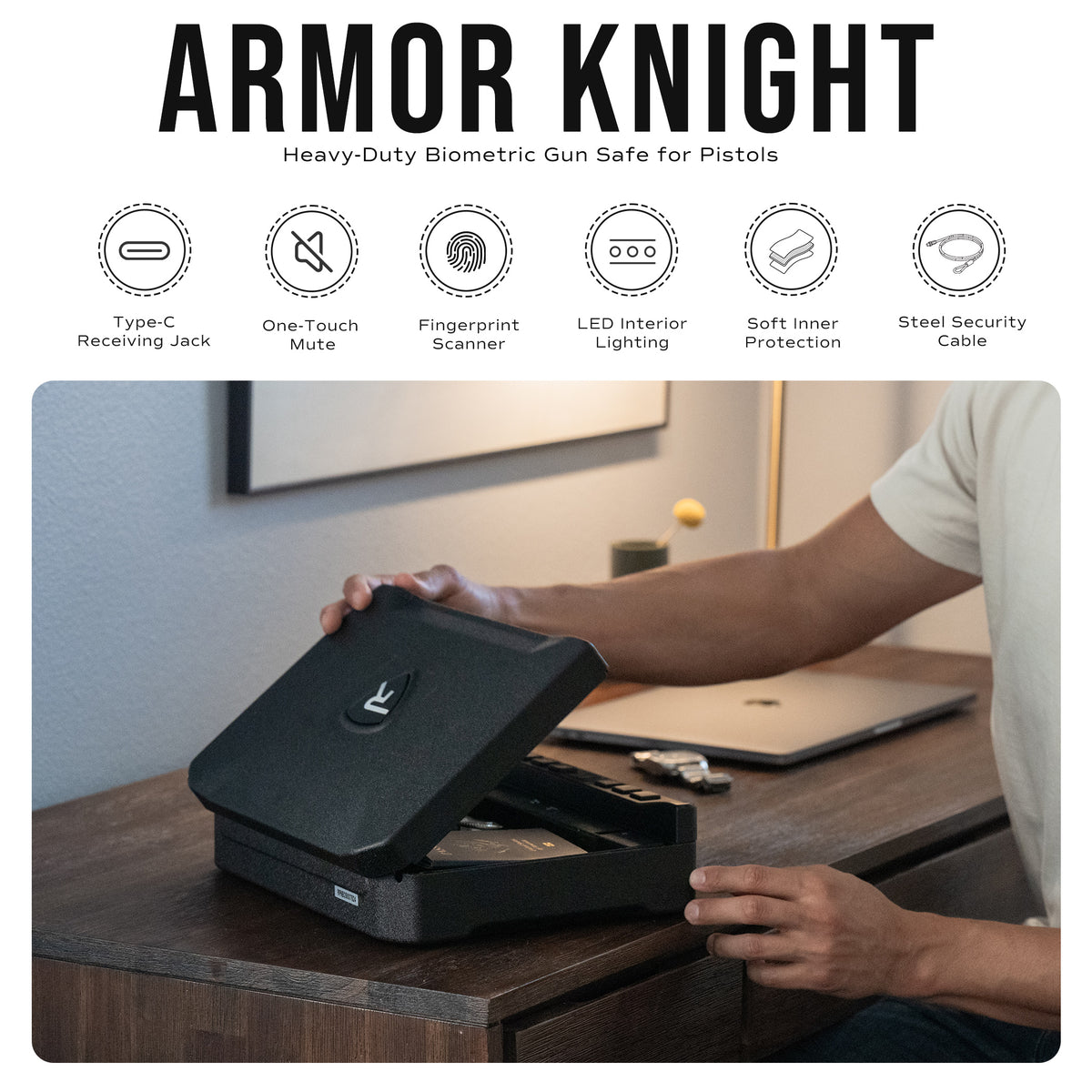 Person using an Armor Knight biometric gun safe on a desk