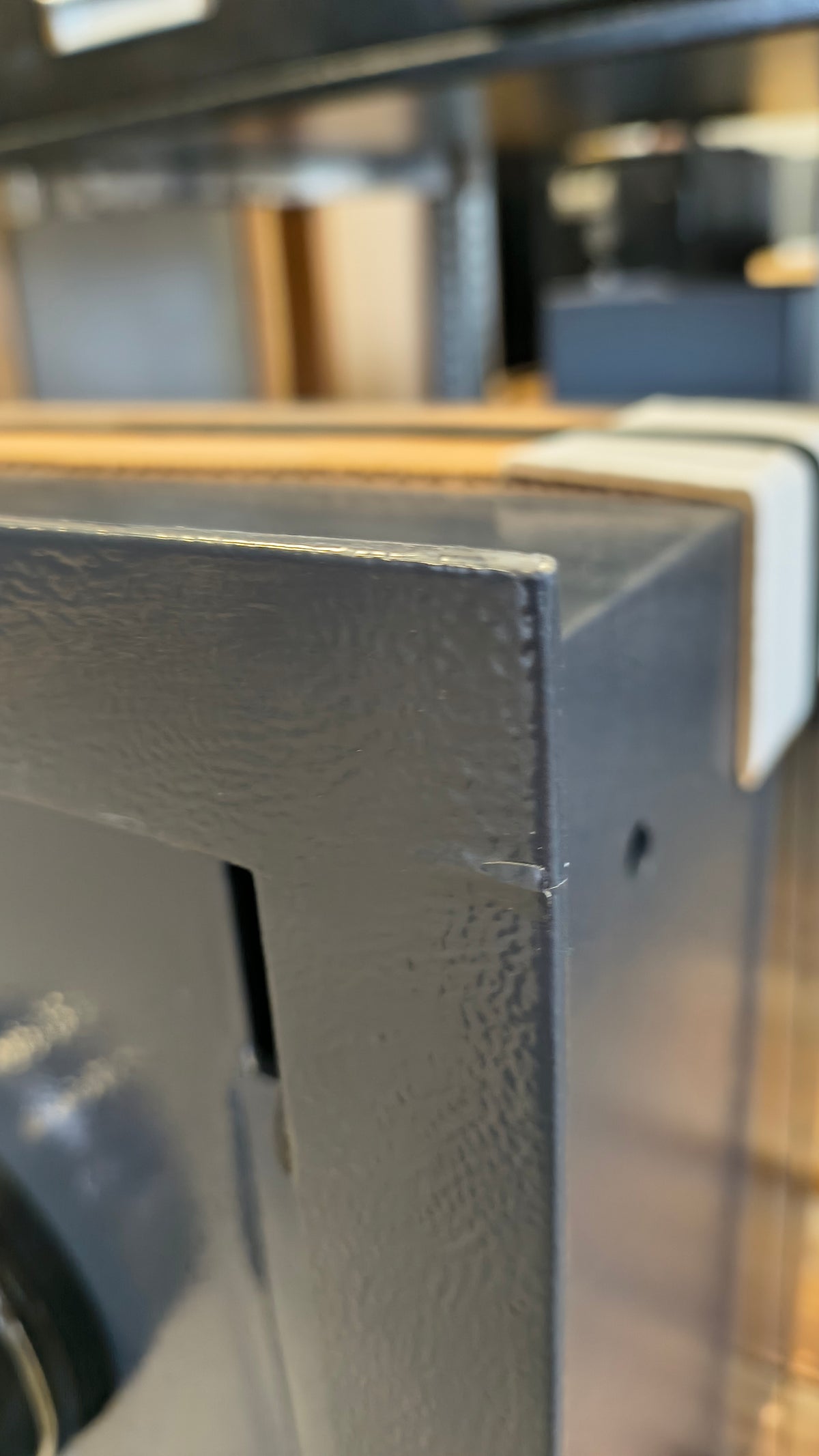 Blemished AMSEC WS1214E5 blemish on top right corner of flange with touch up paint applied. 