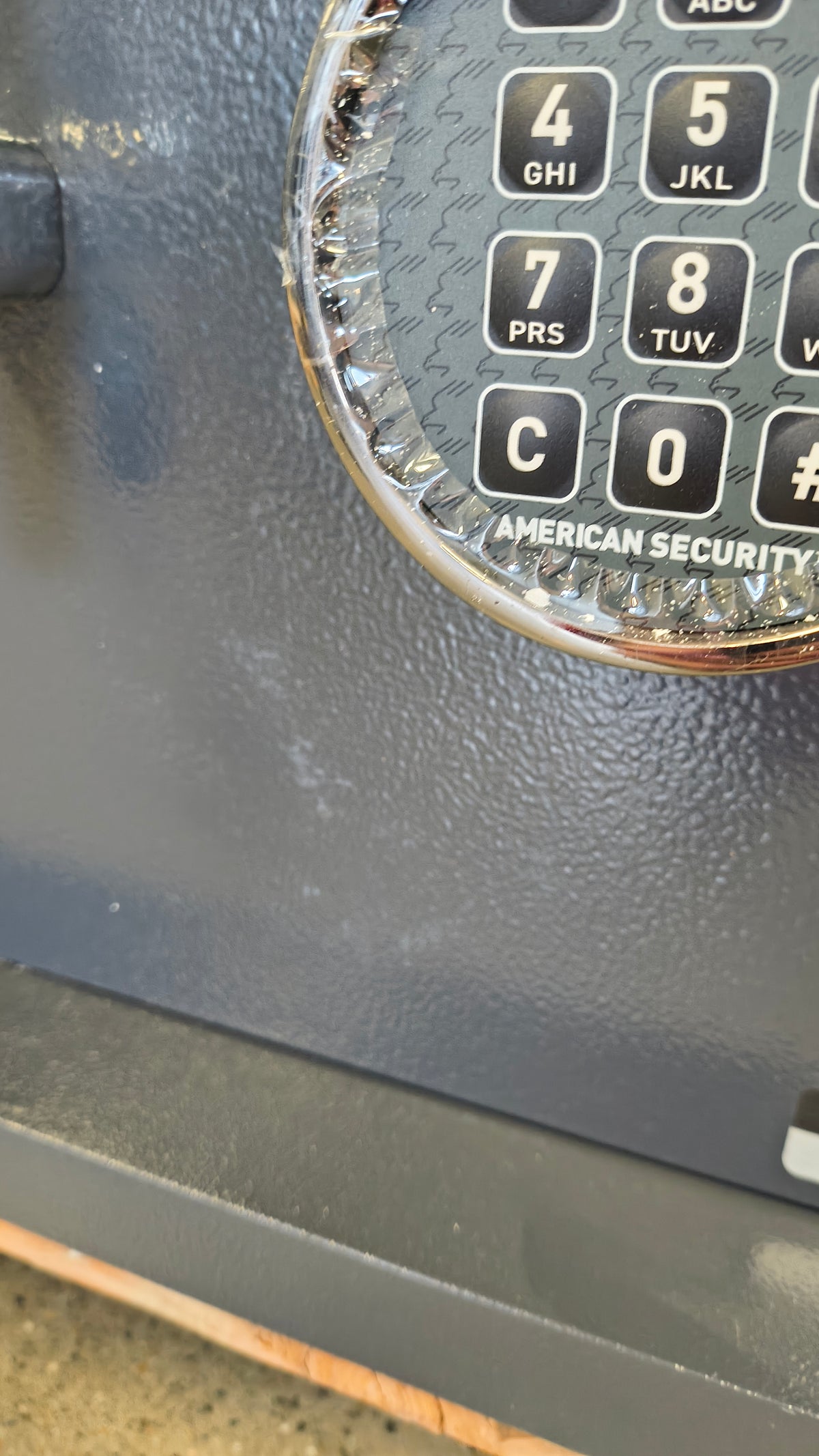 Blemished AMSEC WS1214E5 scuffing near lock. 