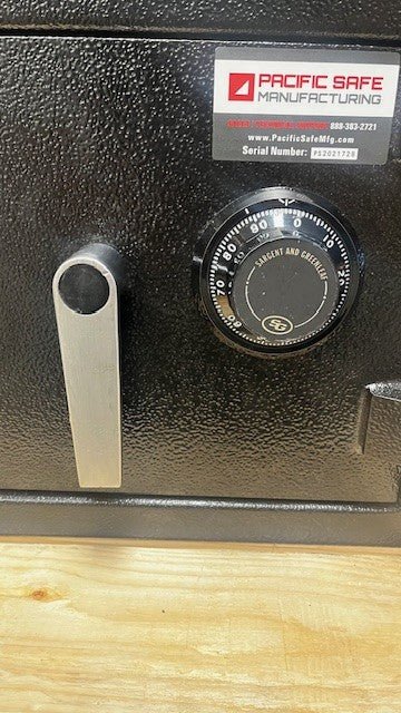 Close-up view of the dial lock and handle. The color of the dial is black and is made by S&G. 