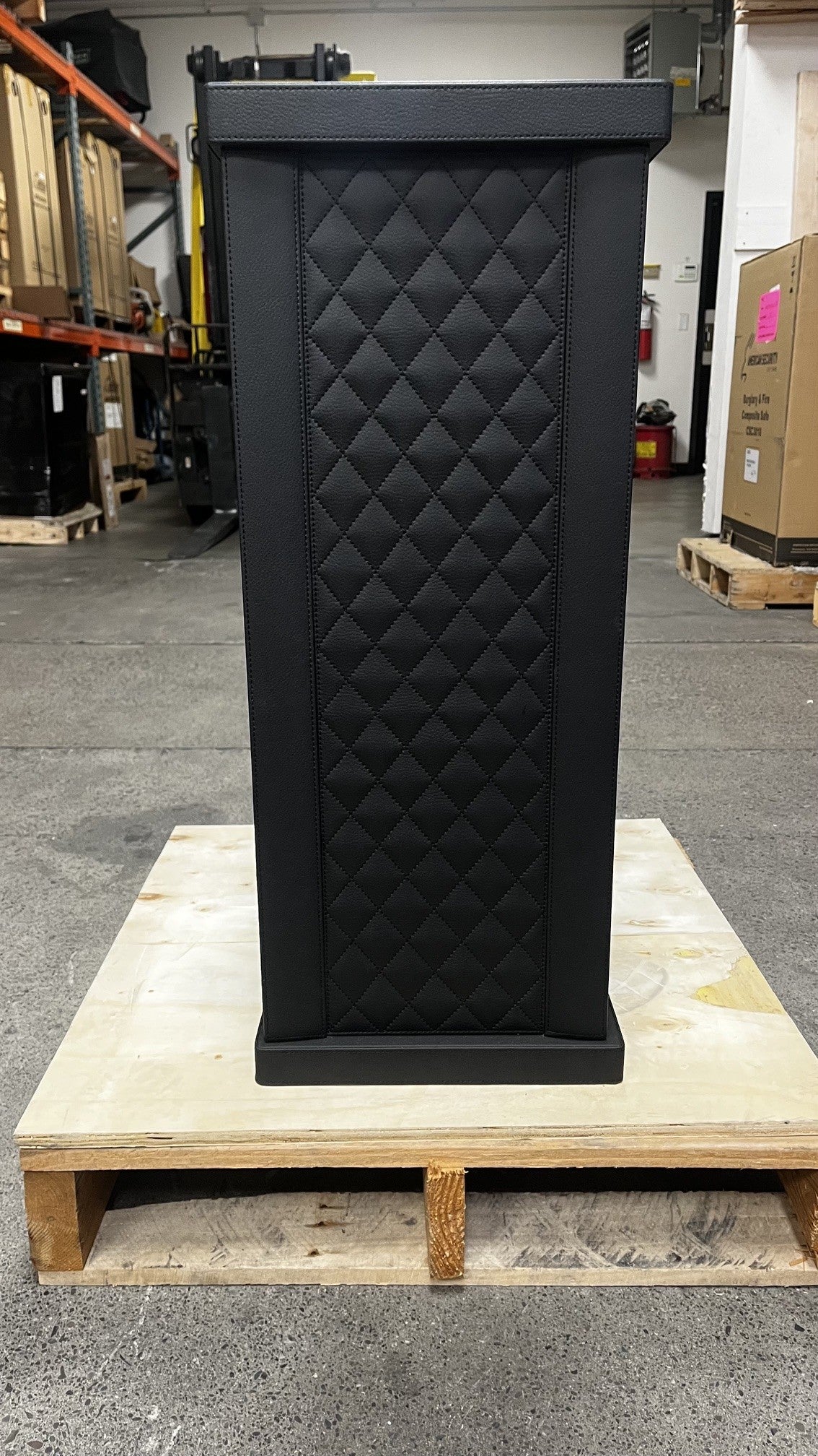 View of the front safe. It has a fingerprint scanner lock with a keypad.  