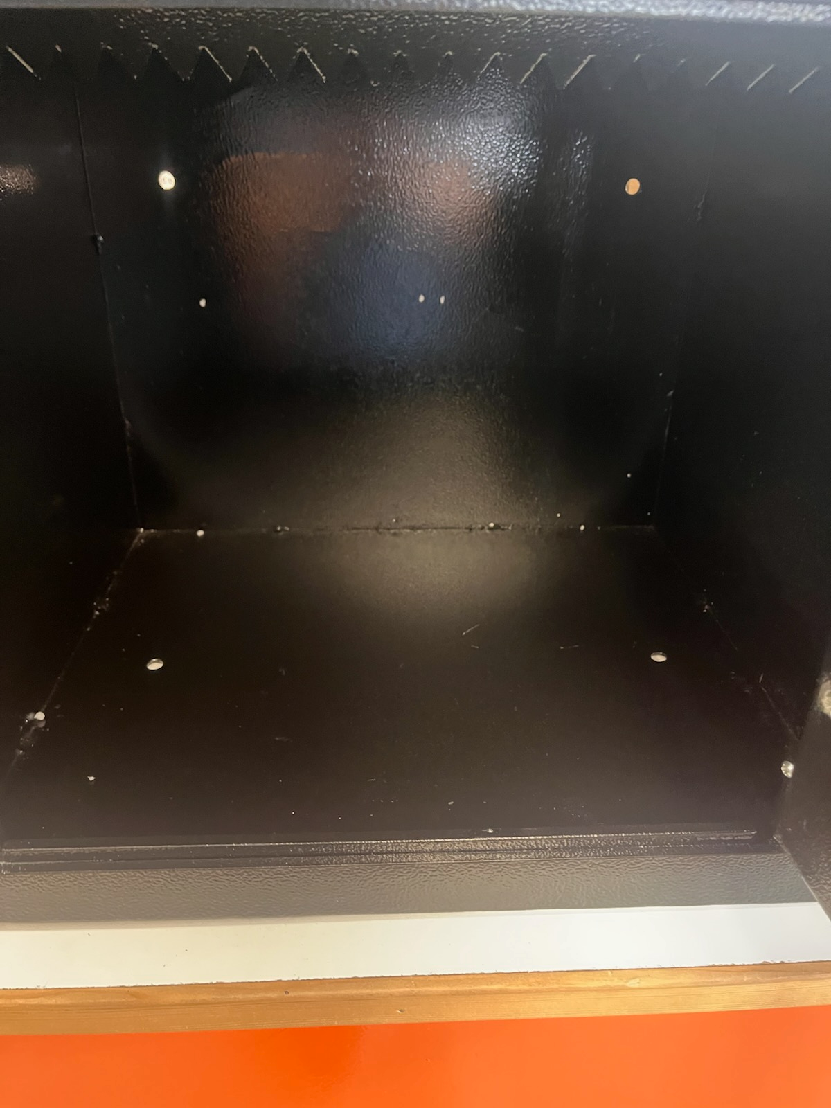 Inside view of the safe. The safe has two more bolt down holes in the inside. 