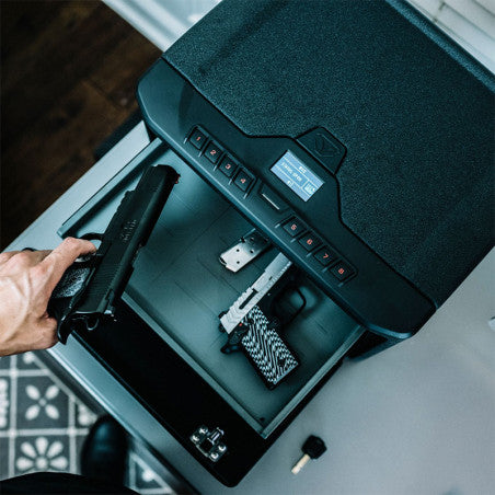 Vaultek Essential MX Large Capacity Rugged Safe Grabbing Handgun Out