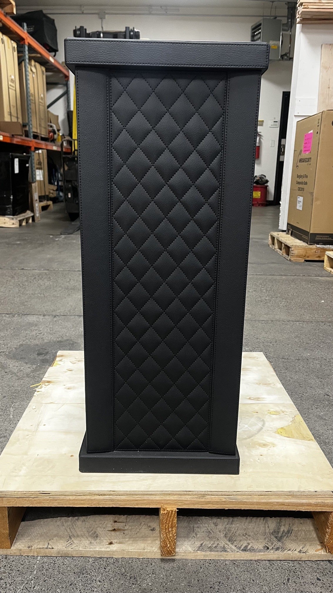 View of the front safe. It has a fingerprint scanner lock with a keypad.  