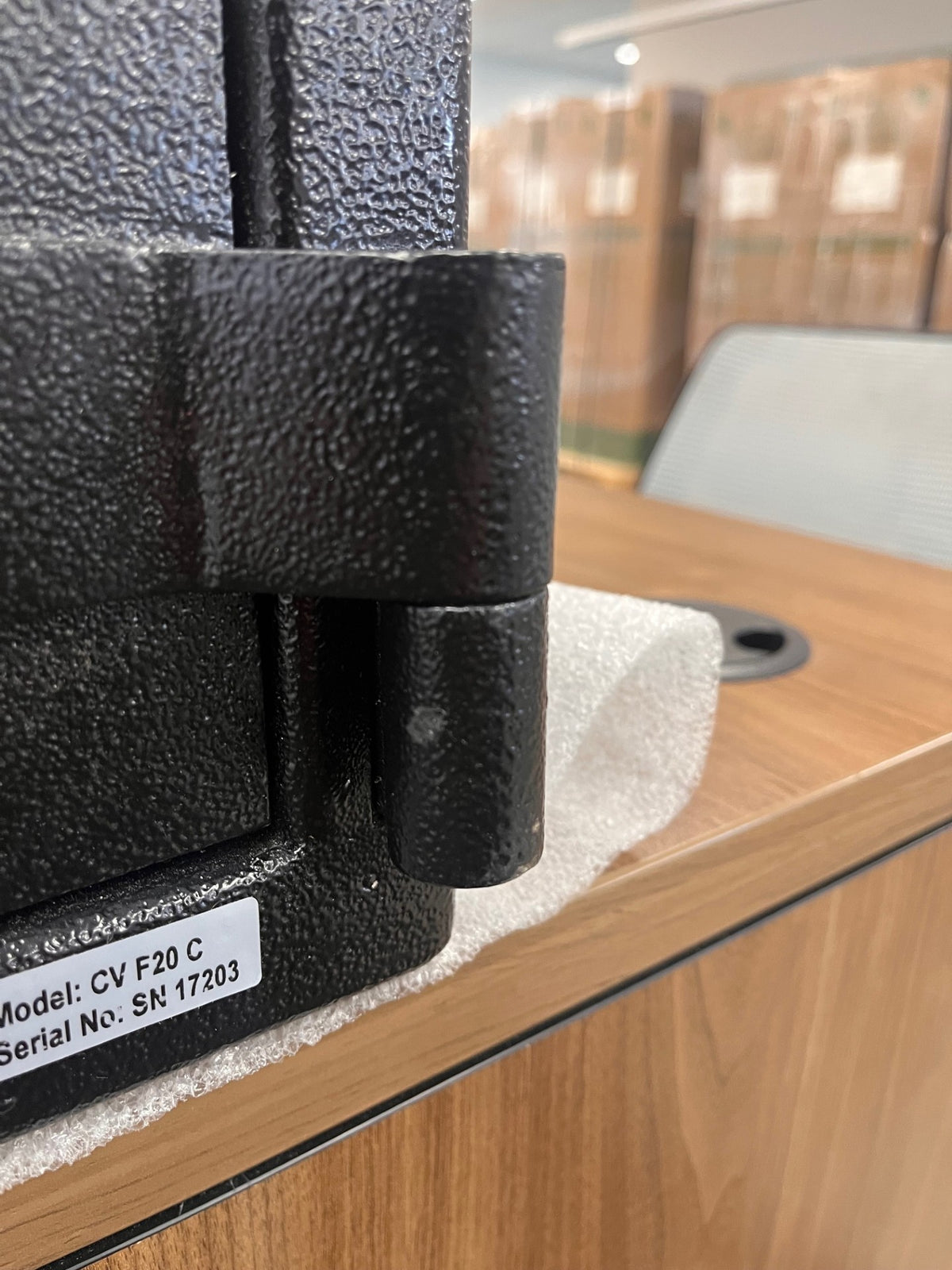 Small paint chip on the bottom door hinge. 