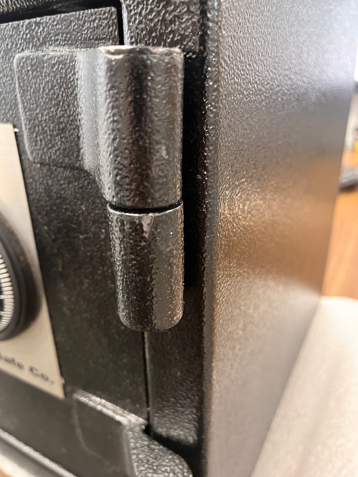 Small paint chip on the top door hinge. 