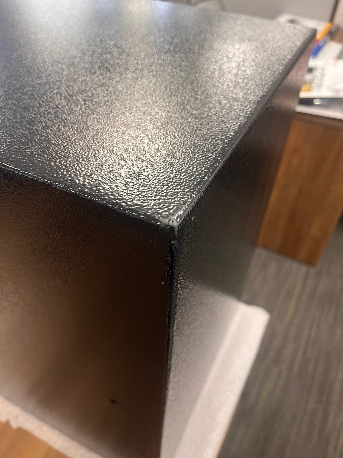 Back top left corner with a small scratch. 