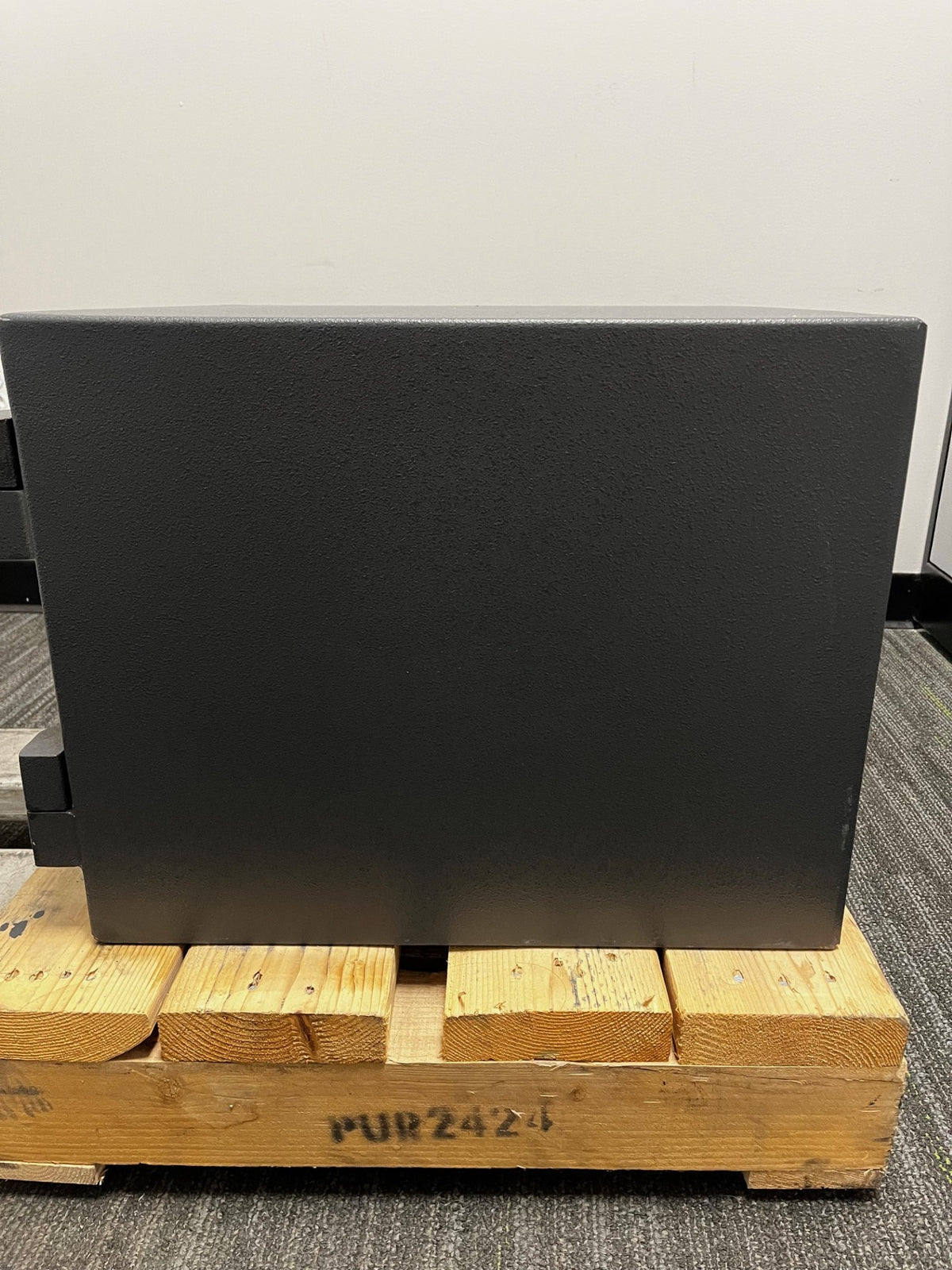 Right side view of the safe. The back edge has some scratches on lower area. 