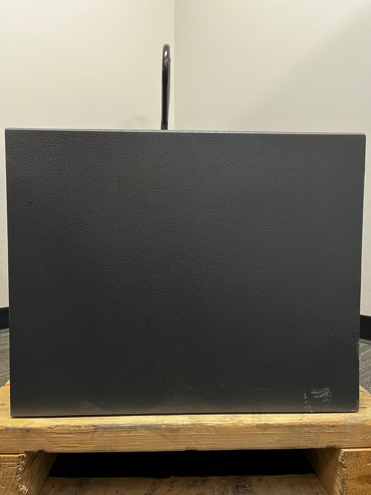 Back side view of the safe. The back some scratches alongside the bottom area. 