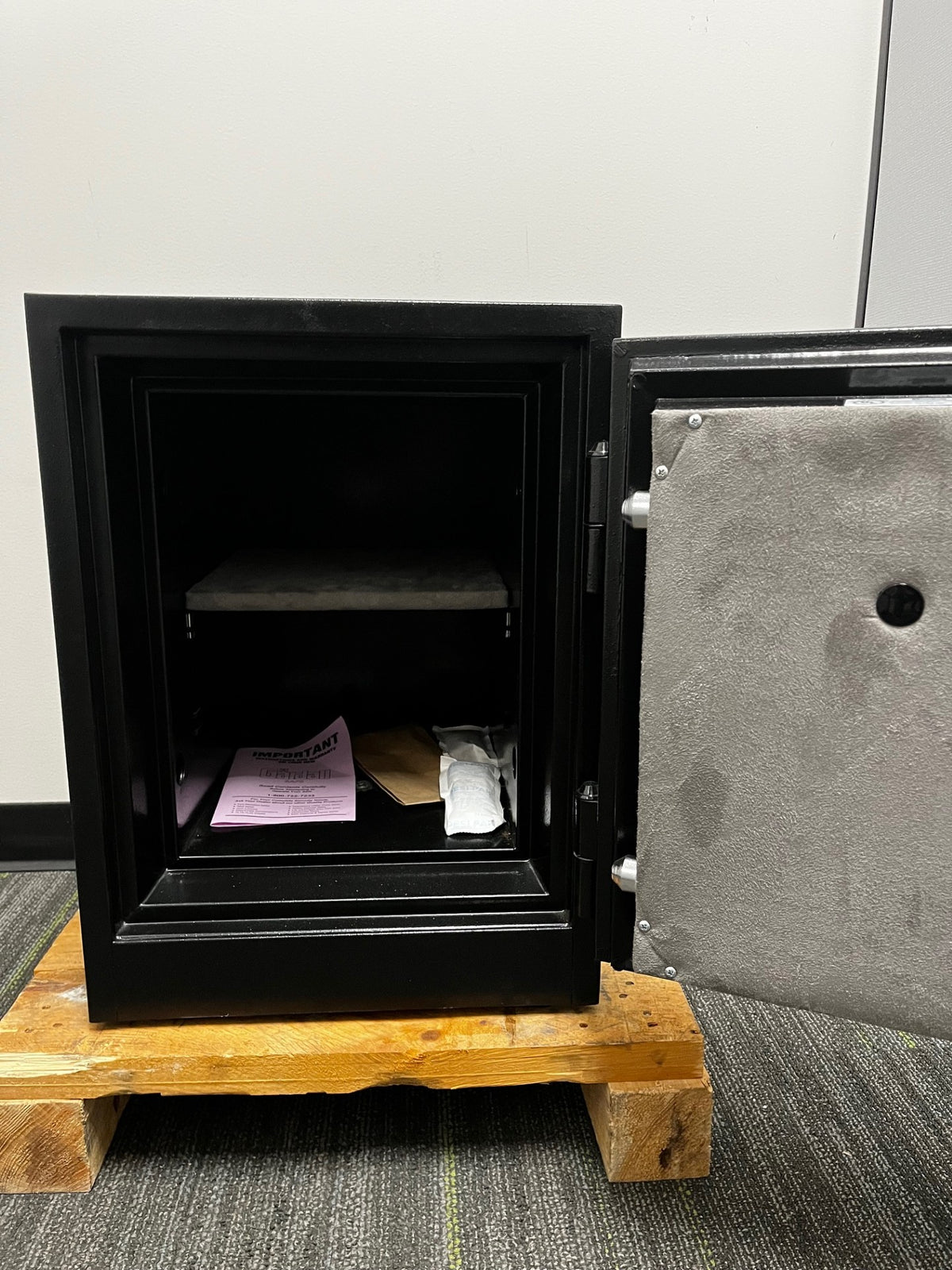 View of the inside of the safe. It comes with one adjustable shelf and bolt down screw. 